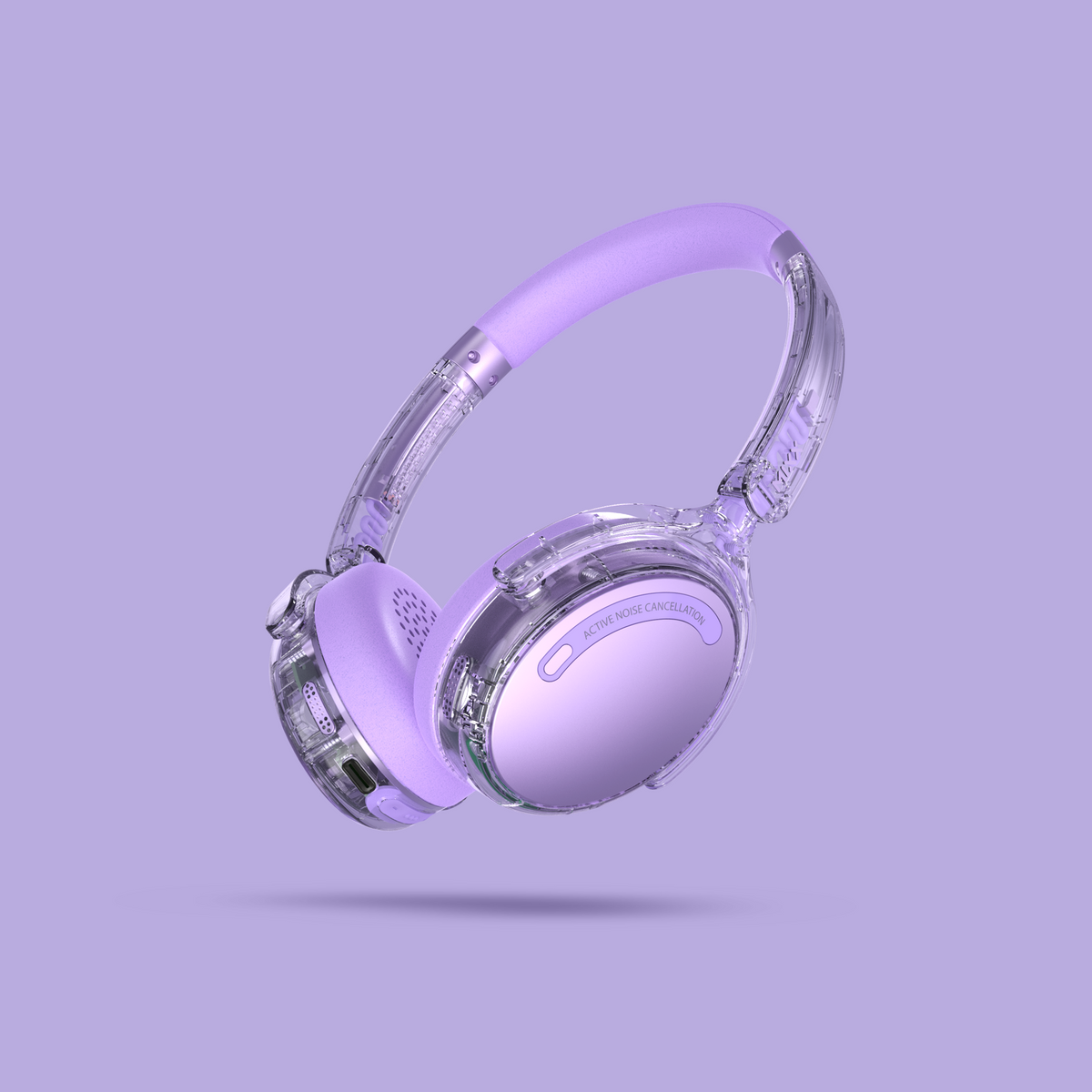 Light purple over-ear headphones with a transparent plastic shell and matching purple headband, shown floating against a solid lavender background.